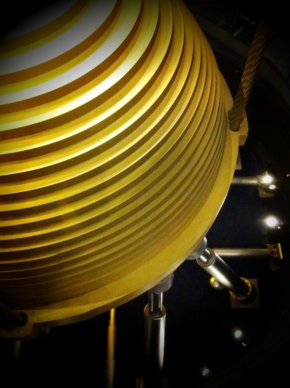 I wouldn't have believed it if I hadn't seen it with my own eyes. You're looking at about one quarter of the tuned mass damper that is suspended inside the Taipei 101 building. All 728 tons of it hangs between the 88th and 92nd floor, and is held in place by massive steel cables from above and gigantic dampers from below. The steel sphere counteracts high winds to keep the building from swaying and being damaged in a typhoon.