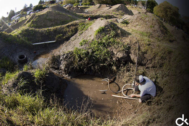 The weather has been less than kind to the jumps lately, with some lakes popping up here and there. We've been using a pump to drain them - much faster than buckets.