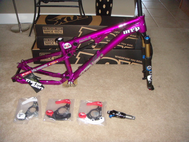 New Slope frame, fork, shock, and custom MRP guides for 2011.  831 for my hardtail, and 180Van in the boxes behind.  Thanks Transition, MRP, Fox, and everyone else for my bikes for the year