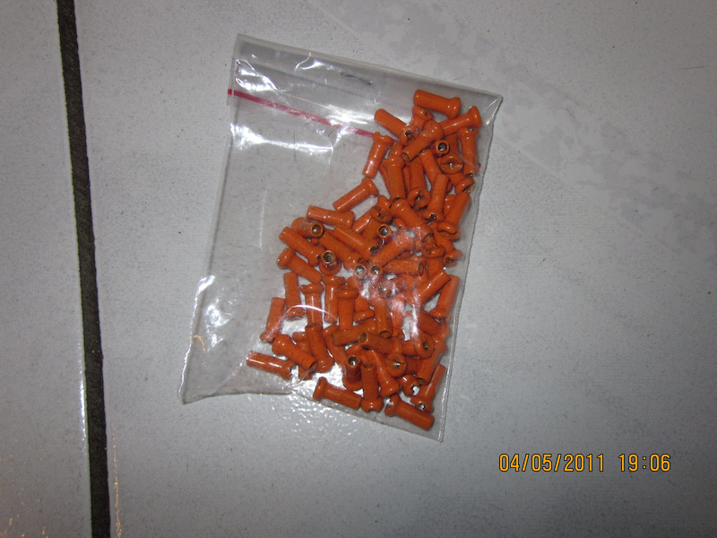 75 pcs orange spoke nipples For Sale