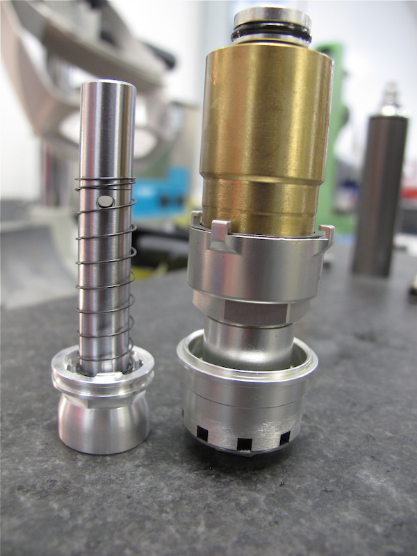 This is what the internals of Specialized's Brain Fade shock look like. The brass weight sits on the spring and acts as the inertia valve.