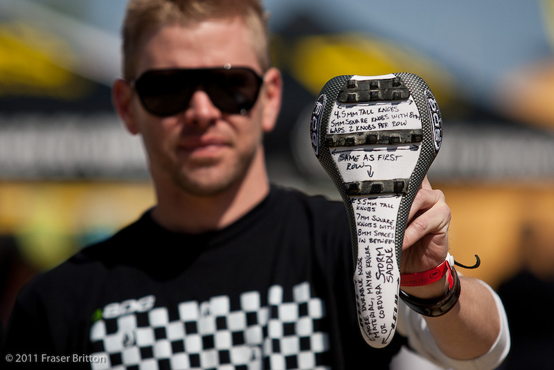 SDG main man, Tyler Anspach, showing off the first Storm saddle prototype that was hand made by Sam Hill's mechanic, Jacy. Tire tread was glued on and notes were written by hand after getting feedback from Sam, and the seat was then sent to Tyler for approval.