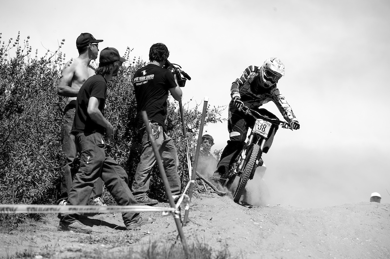 Daniel Cortina slides 'er into the long, slow, fading right-hander near the middle of the course.