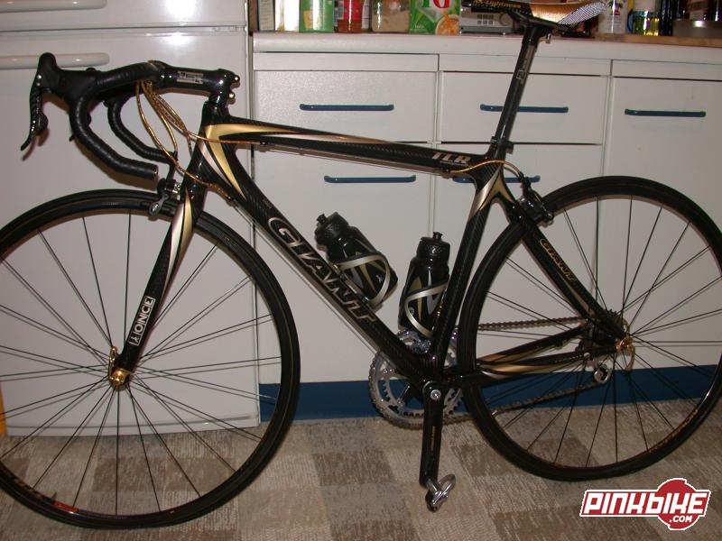 Giant Gold TCR Carbon Record with Hyperons and an AX-Lightness Saddle
