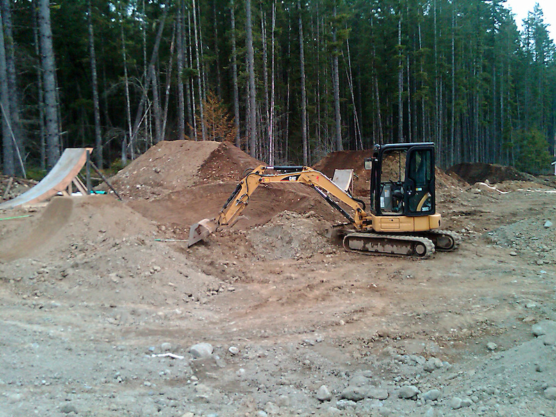 Wood kicker behind the machine - front flip training zone.