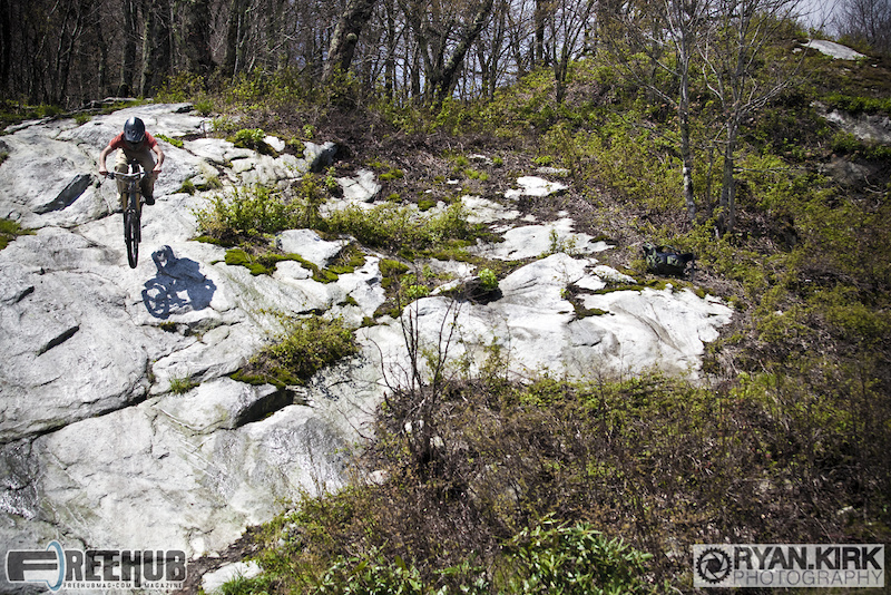 Local Boone rider Steven Trottier gap'n into the rock gnar on Sugar Mountain.