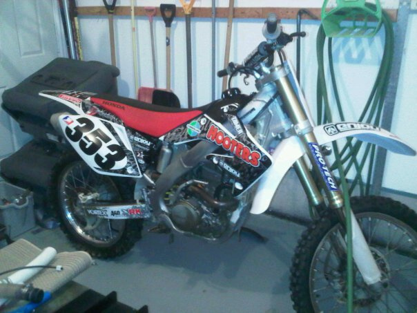 2005 honda crf250r. Brand new white plastics and hooters racing graphics. Just need an all black seat.