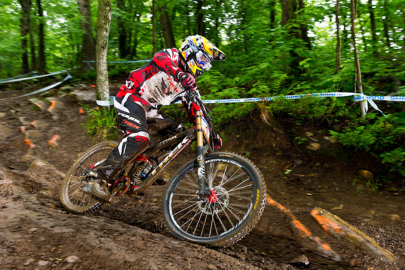 Aaron Gwin putting the new Carbon Trek Session to work during a rainy practice day at Mt St Anne. No specs on the bike. Likely about 35 lbs with that ti spring and other light weight tricks that Monkey has been known to pull keep weight down. Now gossip amongst yourselves with speculation...