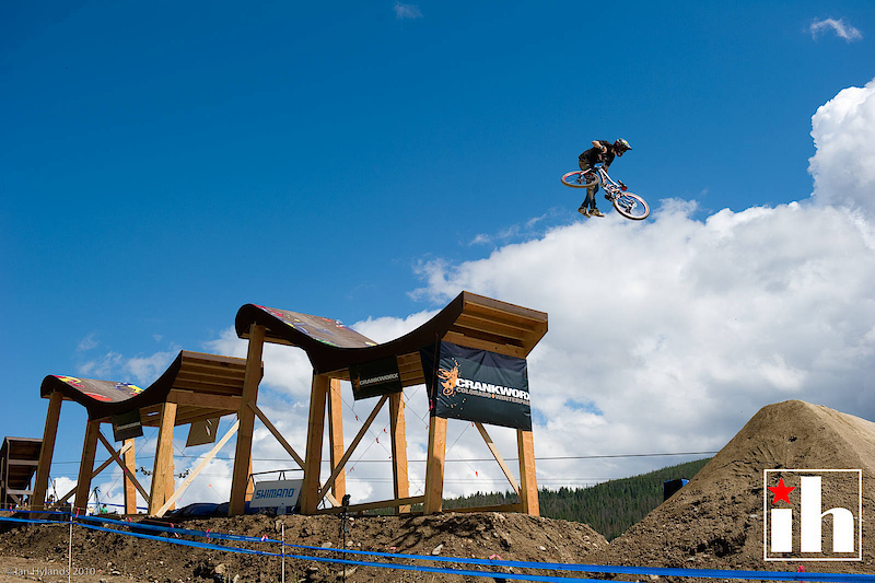Brett Reeder does a tailwhip during Crankworx Colorado Slopestyle Qualifying at the Trestle Bike Park in Winterpark Colorado.