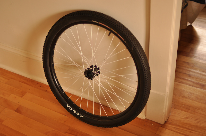 Black Sun Single Track laced to Axiom 20mm sealed bearing hub with white powder coated spokes. 36 hole. For sale.