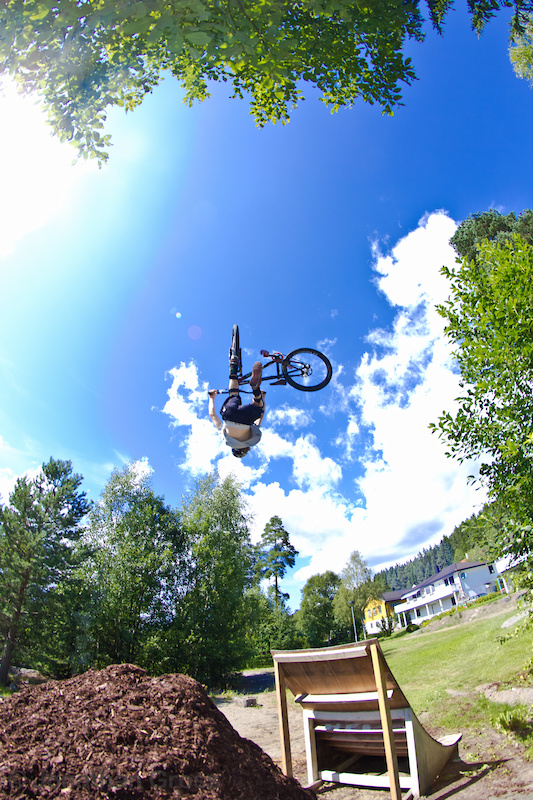 Sindre flipwhiping at his backyard jump. 

Photo: Jonathan Gross