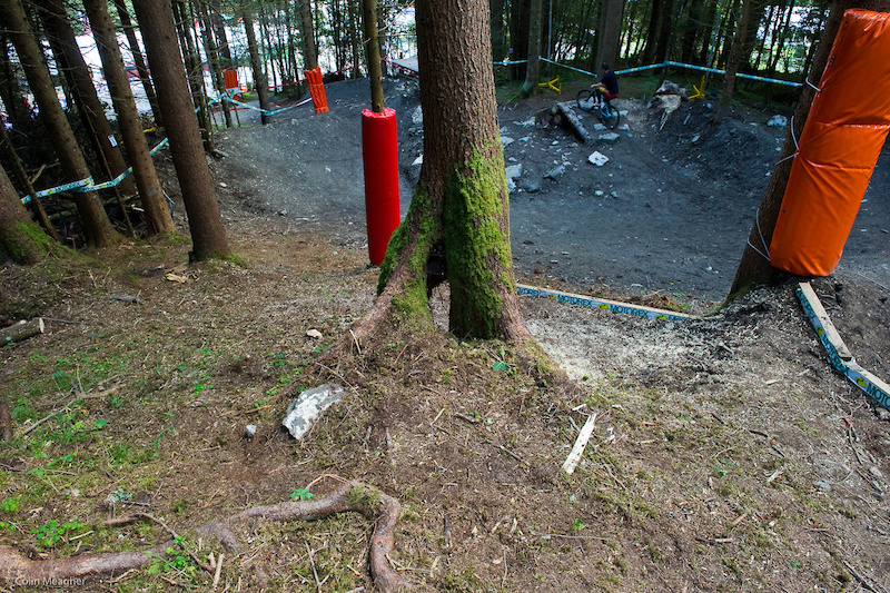 The fast line appears to be rider s right in the woods below where Grubby Graves is scouting but there is a bit of a sneaky line that may see play way over on rider s left.