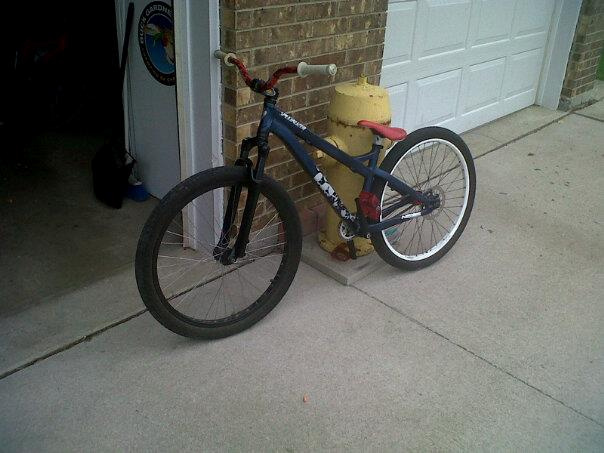havent uploaded a pic in awhile thought everyone would like to see what she looks like now, brand new forks, locked out in picture, new pedals, bars and grips cant wait for new front rim.