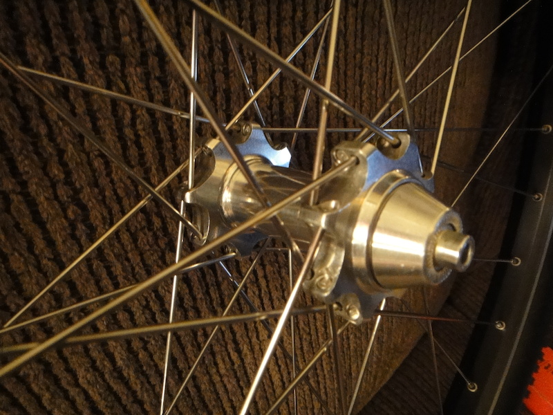 Up for sale best offer *over* $225 are a fully built set of 32 spoke SEALED PulStar hub'd,.on Sun Rhyno Lites,.eyeletted,.with DT Competion PulStar Dbl Butted spokes. Included are a pair of BRAND NEW  Kenda Small Block 8's (only 30tpi casings) with 10 EXTRA spokes with nips. The spoke are 274mm and fit rear drive AND non-drive side,..AND front as well. These are the magic spoke length to fit anywhere on this wheel set. These ARE of the latest PulStars manufactured,.1997 I think,.and they are SEALED. They are in NEW condition as they were only on a "loaner bike" of mine for about 5 or 6 trail rides. The spokes are UBER RARE and you will get 10 extra with this sale. I will be uploading a video of the front and rear spinning to show how perfectly true they are,.side-2-side as well as no hop. I expect there to be more than 1 PinkBiker interested in these wheels as they are VERY RARE to find ,.SEALED bearing type,.especially in this condition. I paid $150 alone for the hubs 2 years ago so NO LOWBALL offers,..PLEASE?!?
 NO LOWBALLING as it causes IMPOTENCE,.if not already suffering from LOWBALLING IMPOTENCE from prior offers made!! All LOWBALL offers will be posted in a forum and you will be made fun of,.. accordingly so,..