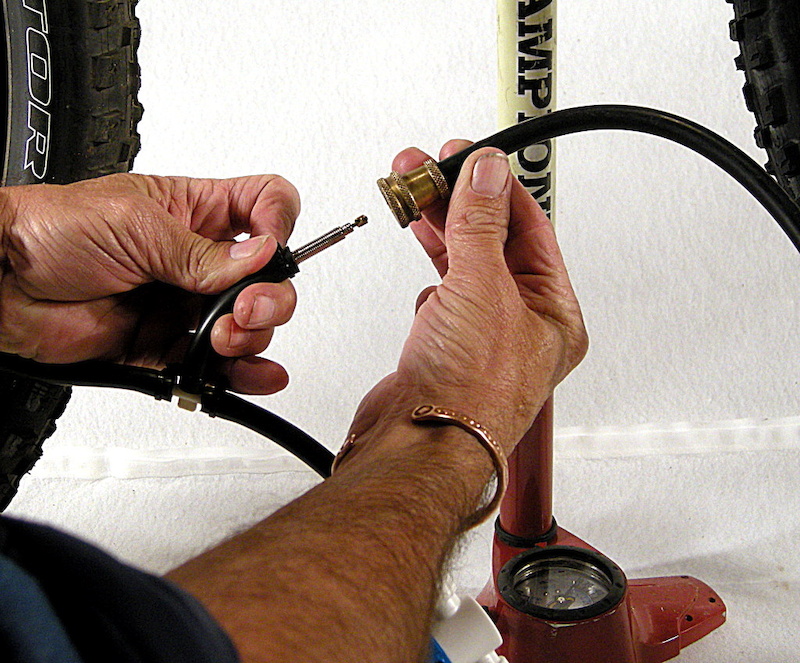 Hook up the floor pump to the Presta valve on the Tee and than inflate the host tire to its maximum rated pressure.