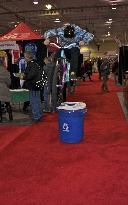 Hop over trash can in the middle of the bike show