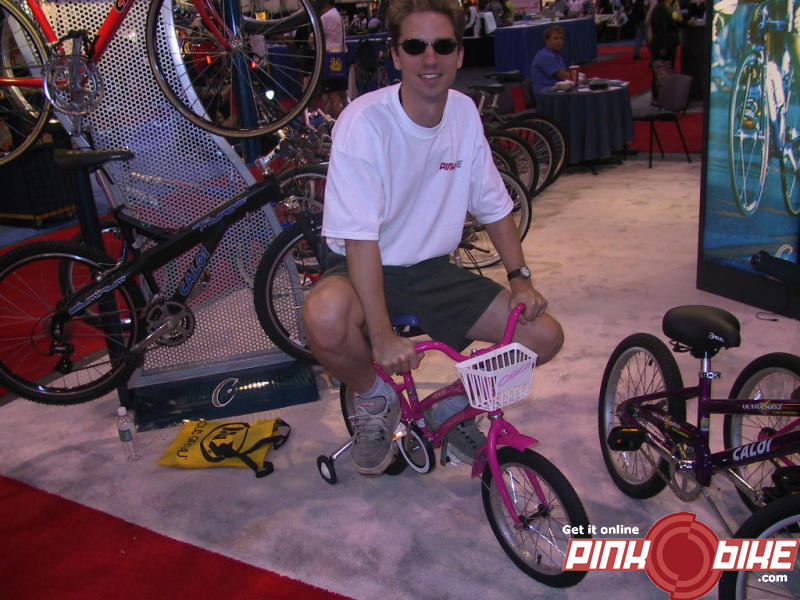 The pinkbike crew made sure they could be easily spotted and recognizable at the show.  Here is one of them now.  If you see people riding little pink bikes, stop them, and say hi! :)