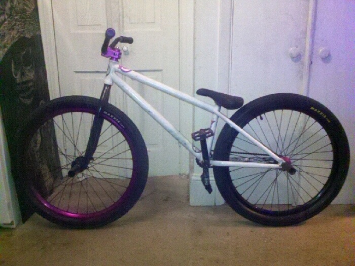crappy cellphone picture just showin the additions to color scheme, purp wheel, black bars, purp pedals