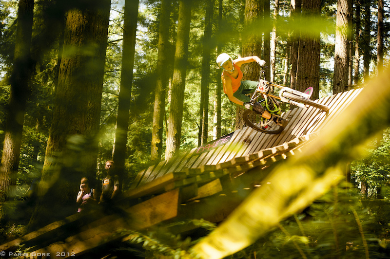 One of the only Pro women on a DH bike Lorraine was sending it huge over all the features on the pro course.
