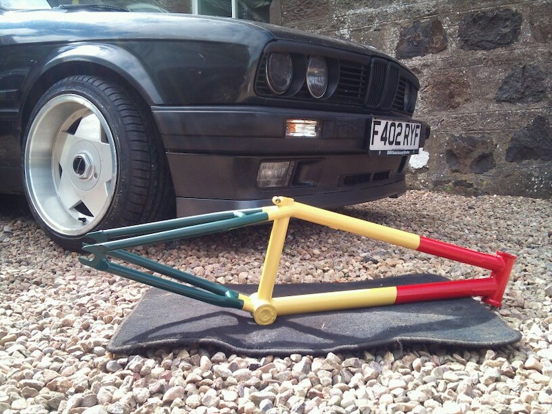 MY cult os v2 just after paint in front of my friends e30.