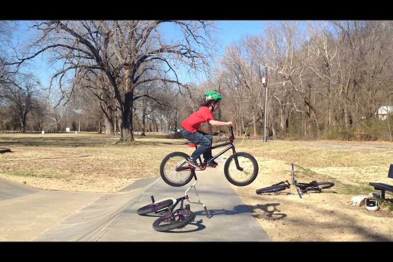 Dylan doing a flyout over my bike