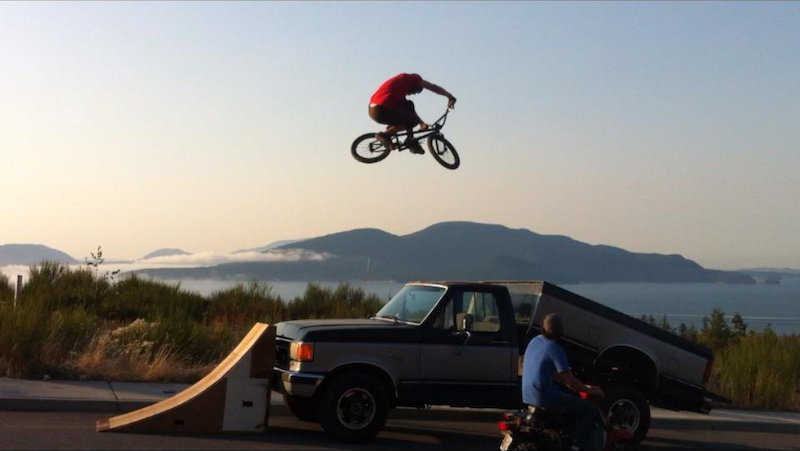 Ramp to truck bed!  super gnarly landing.  Yes he wears a helmet!  Photo by Richy Holman