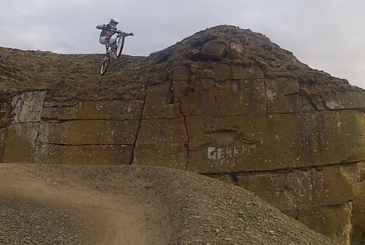 dropping off the wall into the banking on the side of the pumptrack