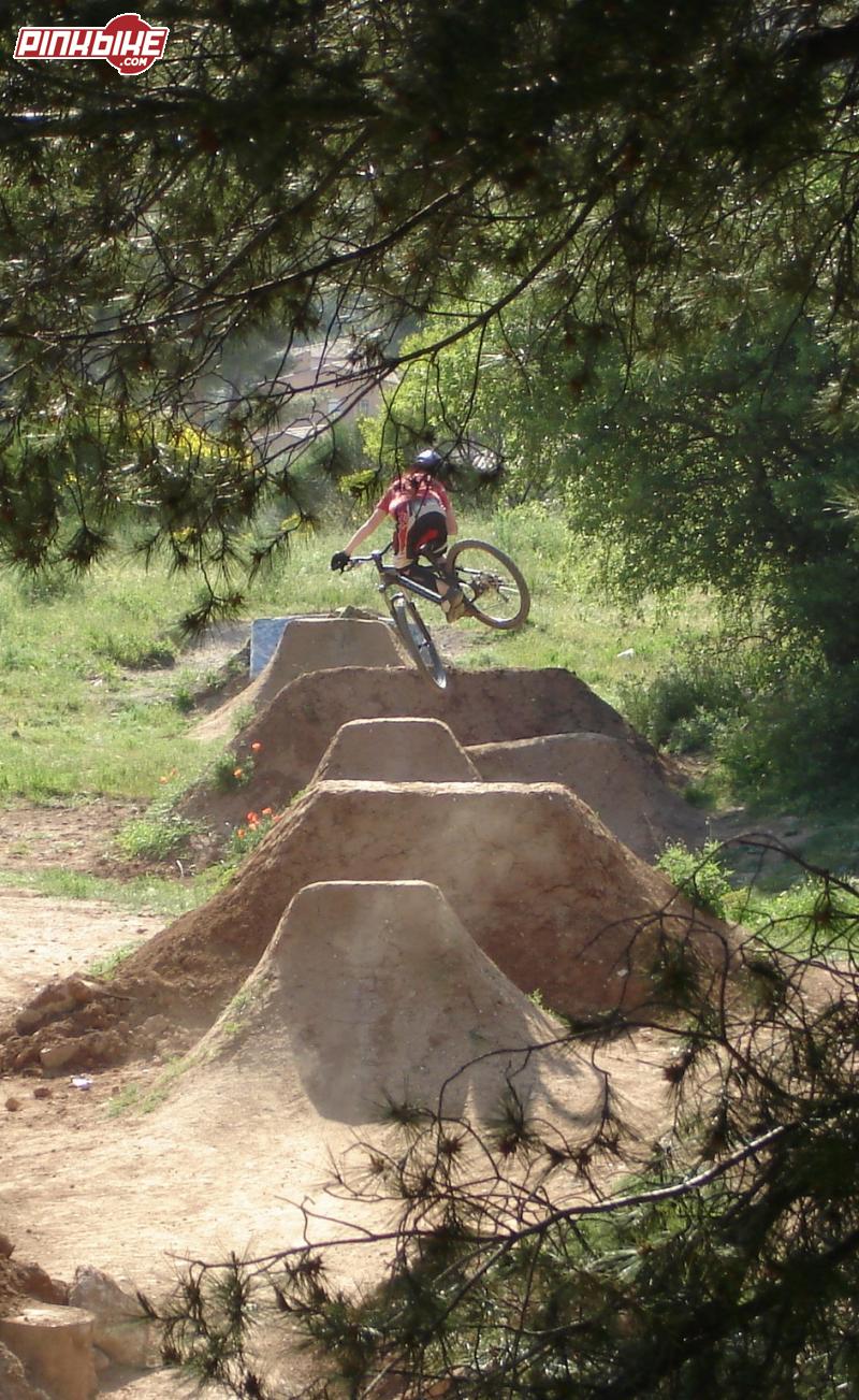 Some style on the first jump of the line. Baudouvin is a really nice place with some good shaped dirt jumps,  gaps, drops and cool riders. Thanks Guillaume Chancrin for this sweet shot between the trees who was POTD on 2006-05-18.