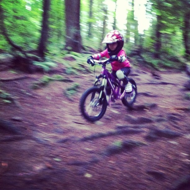 My (and my husband Brett Tippie's) 4 year old daughter getting to grips with some roots on the North Shore.  She loves riding!  

I'm so proud of her I'm almost combustable haha!  LilShredder bike.