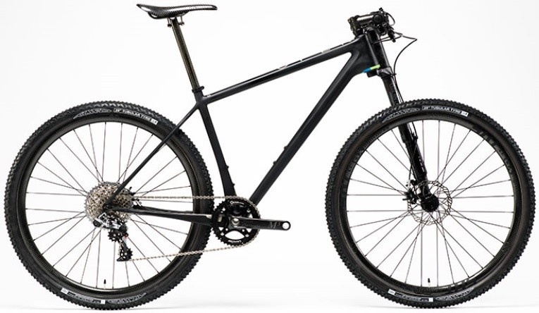 Open 0-1.0 AXX1 Edition Carbon 29er hardtail
Weighs in at 16.1lbs (7.3 kg) WITH gears and 100mm of front travel. Just imagine what it would weigh in at as a rigid singlespeed... damn.