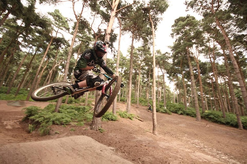 team rider aaron throwing a table down over the chicksands double 
photo credit to loam9