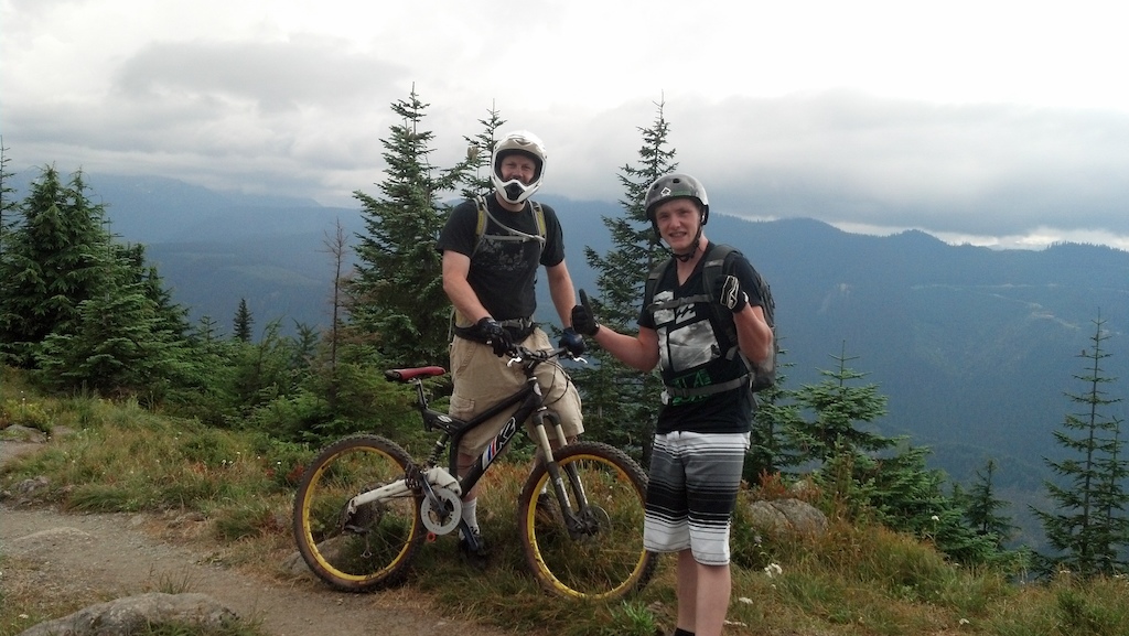 Me with my old school disco monkey, and Travis giving a thumbs up for the gnarly singletrack we are about to shred.
