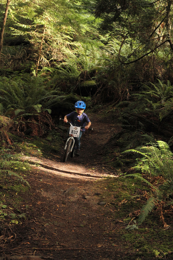 IMBA's "Take a kid Mt biking Day" Anacortes Community Forest Lands.  Ethan coming in hot into a pretty steep section for coaster brakes.