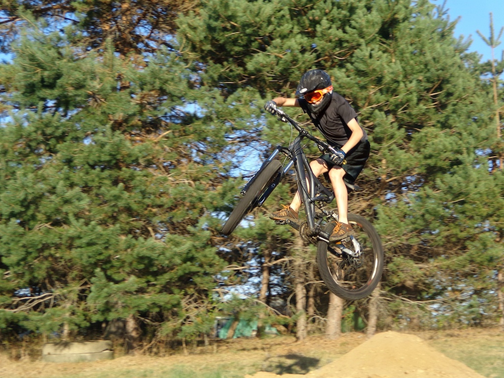 Jumping my downhill bike and posing for some pictures.