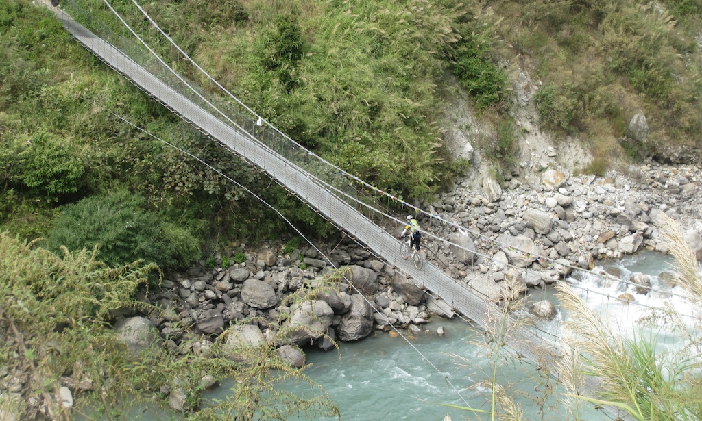 Riding over suspension bridge at bhote koshi river.Photo By. ROBERT.