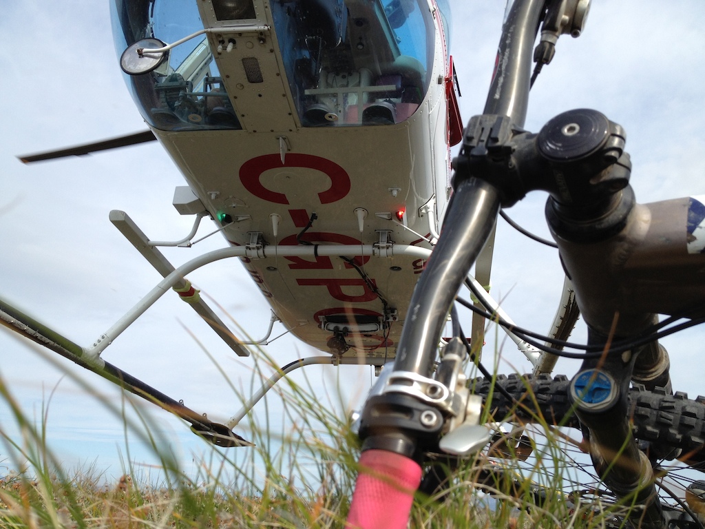 August 2013 Yukon Trip - Heli-biking (https://www.facebook.com/Yukonhelibiking) near Carcross. Photo by JC.

Dropped off on the ridge we unload the gear...