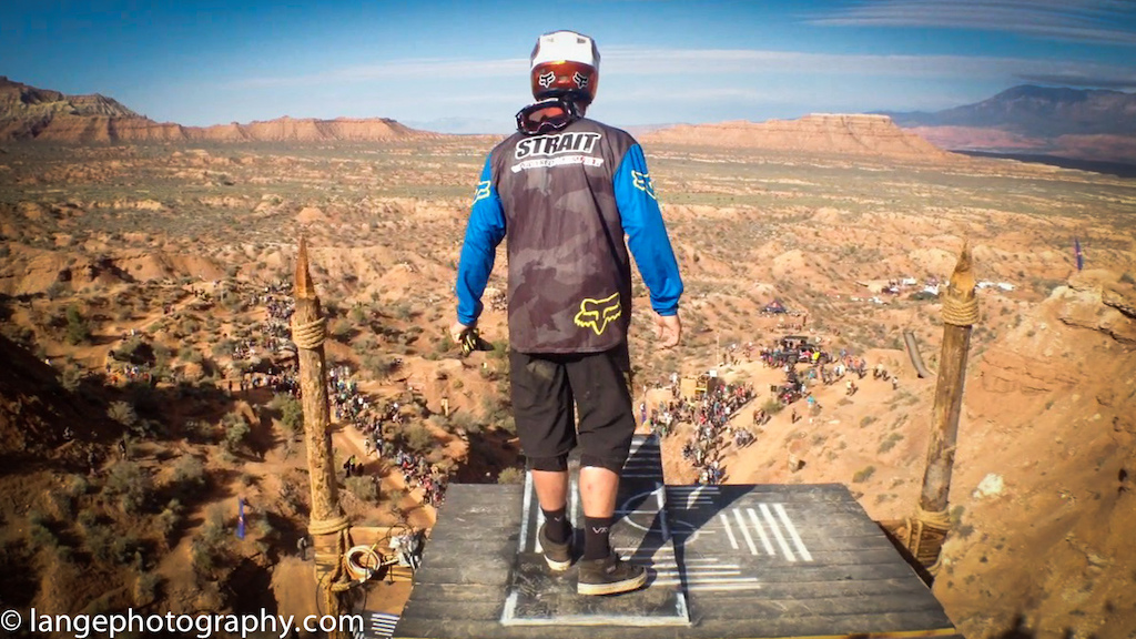 kyle strait takes a peak over the edge of the icon sender at redbull rampage 2013