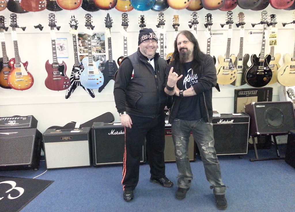 Down at Cranes Music, Cardiff. Chatting with Jeff, bass player with thrash band Onslaught.