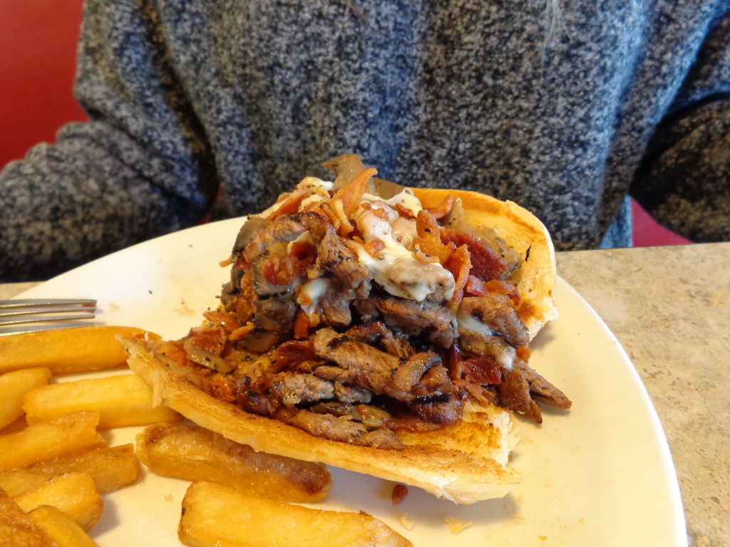 Steak Bomber...

Grilled Rib-Eye, Bacon shreds, Mushrooms, and melted Mozzerella...w/ all the fries you can give me!