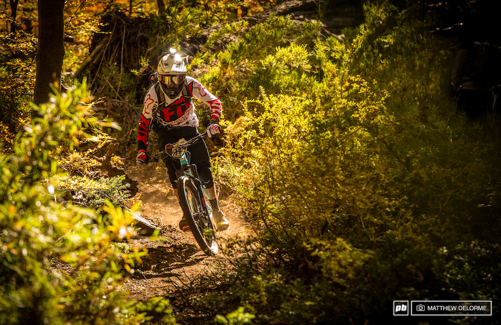 Iago Garay enters the forest section of Stage 2. The dirt here is a rich coffee bean brown fine and just perfectly damp below the surface. Perfect hero dirt.