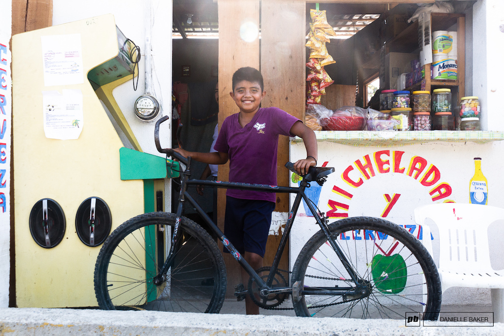 The local arcade and tienda are home to this boy and his jacked up handlebars.