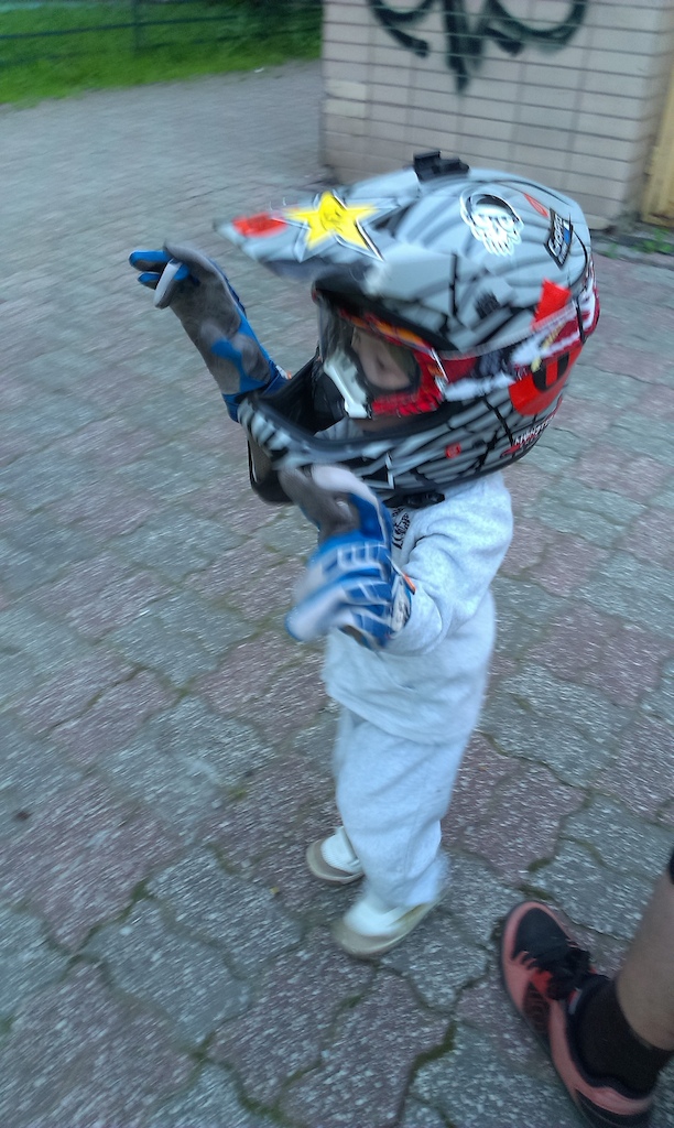My son having fun with my helmet