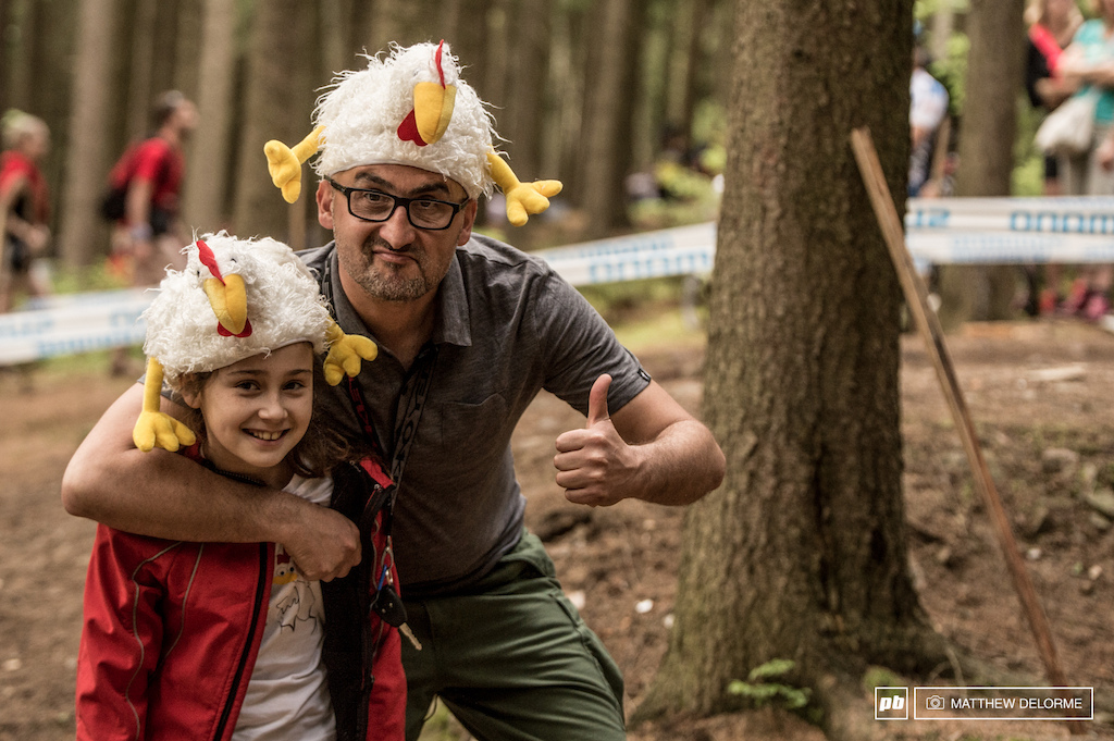 Because man and daughter with poultry hats on their heads, that's why.
