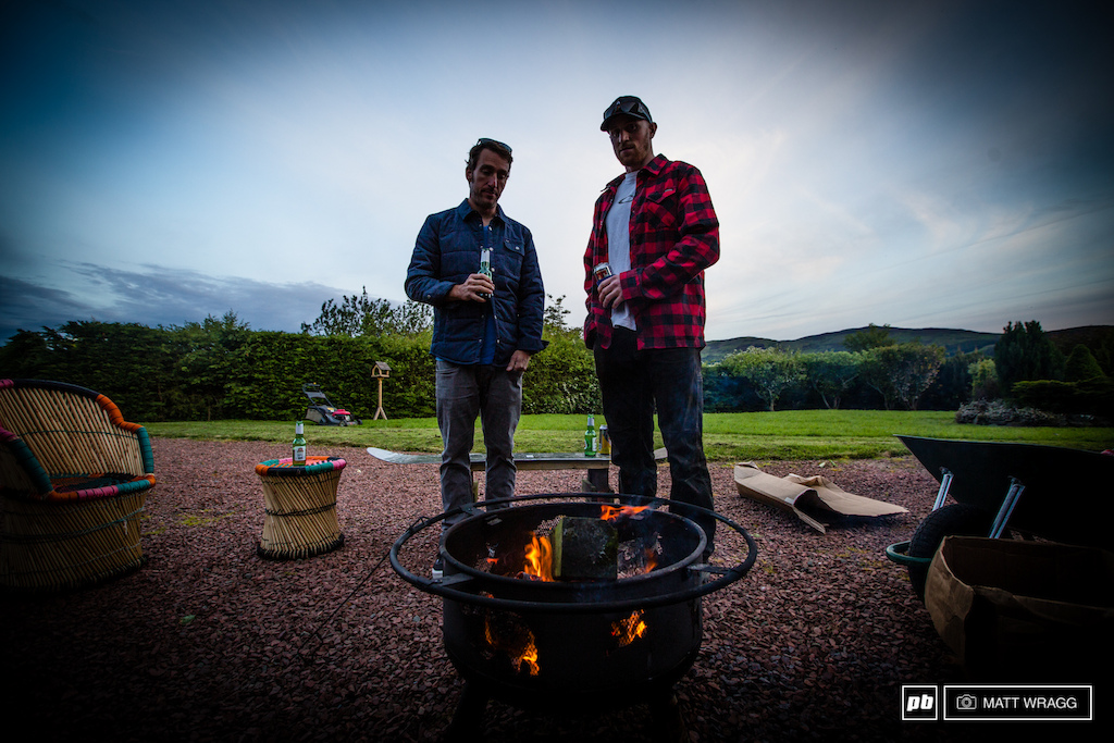 SRAMs Jon Chancellier and Paul enjoy a relaxed beer and a good fire on the night before the preparations kick into full speed and practice begins.