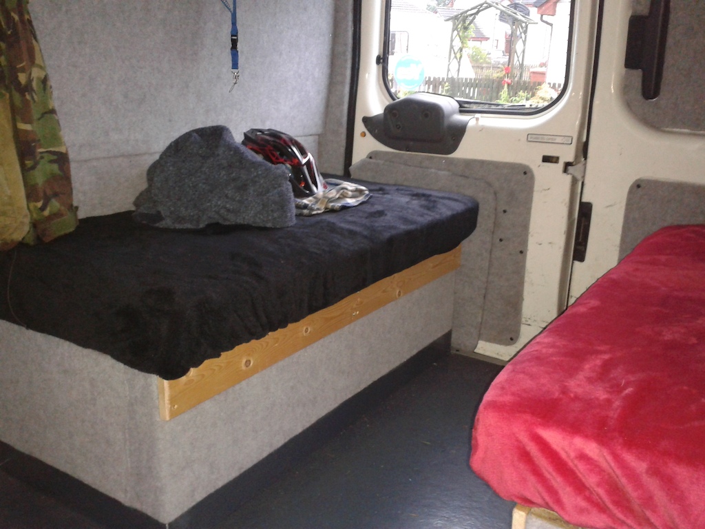 2 bench seats with loads of storage underneath. I can place boards across the middle gap to make a single or double bed.shutters for rear windows too and LED lights.