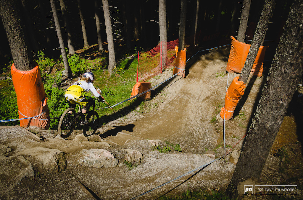 Rachel Atherton takes the plundge into the first section of forest.  Believe us when we say it.  This section is way steeper than it looks.