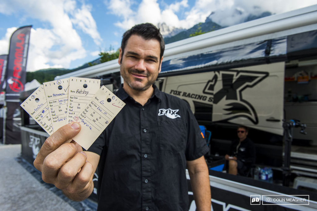 Jordie Cortes of Fox Racing shox showing off a couple of aces and two wild cards from the collection of service cards for Leogang the morning before the final.