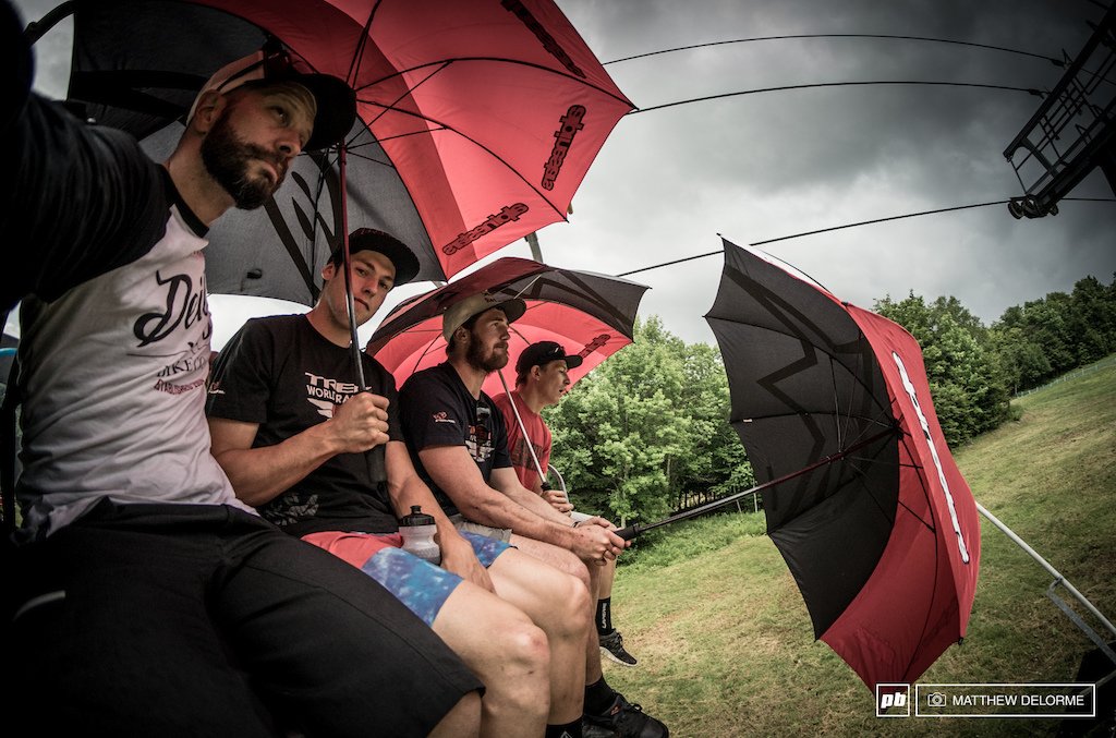 Sam Blenkinsop, Brook MacDonald, and Greg Williamson head up the lift well covered from scattered rain showers to inspect the track on foot. This was one of the shortest track walks ever. Not much in the way of line choice, and it's kind of straight downhill.