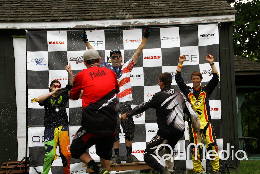 Beer shower on the pro podiums at Launch