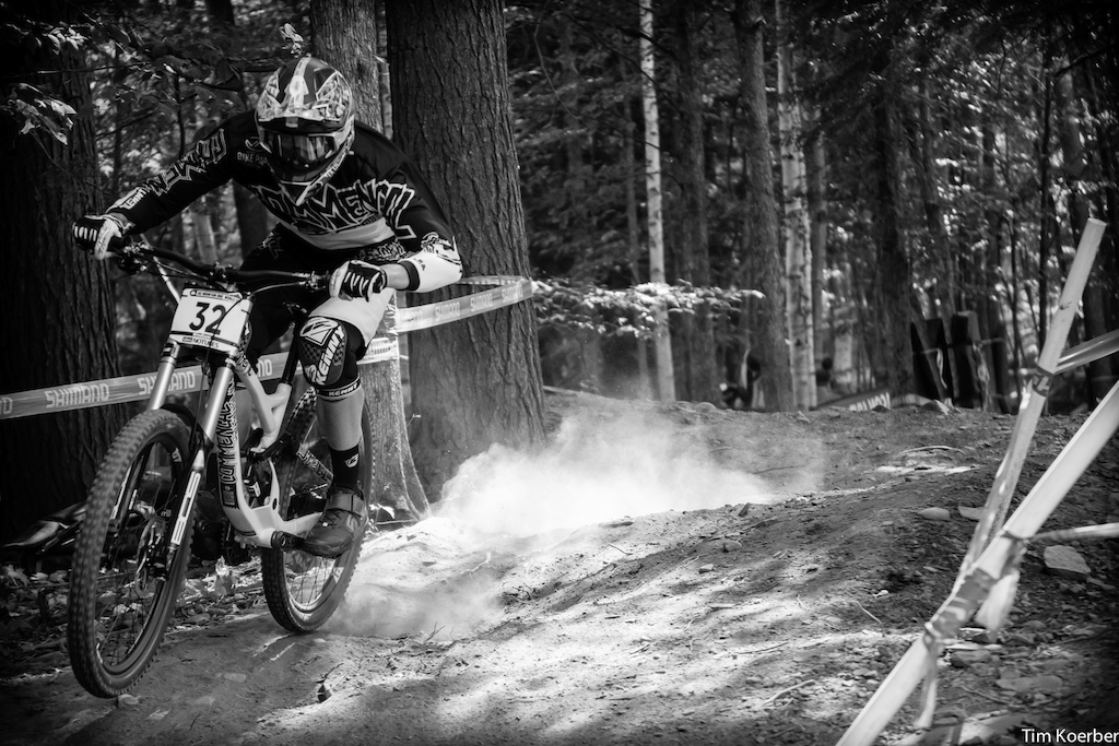 Commencal rider Faustin Figaret exiting the woods during qualifying at UCI round six in Windham